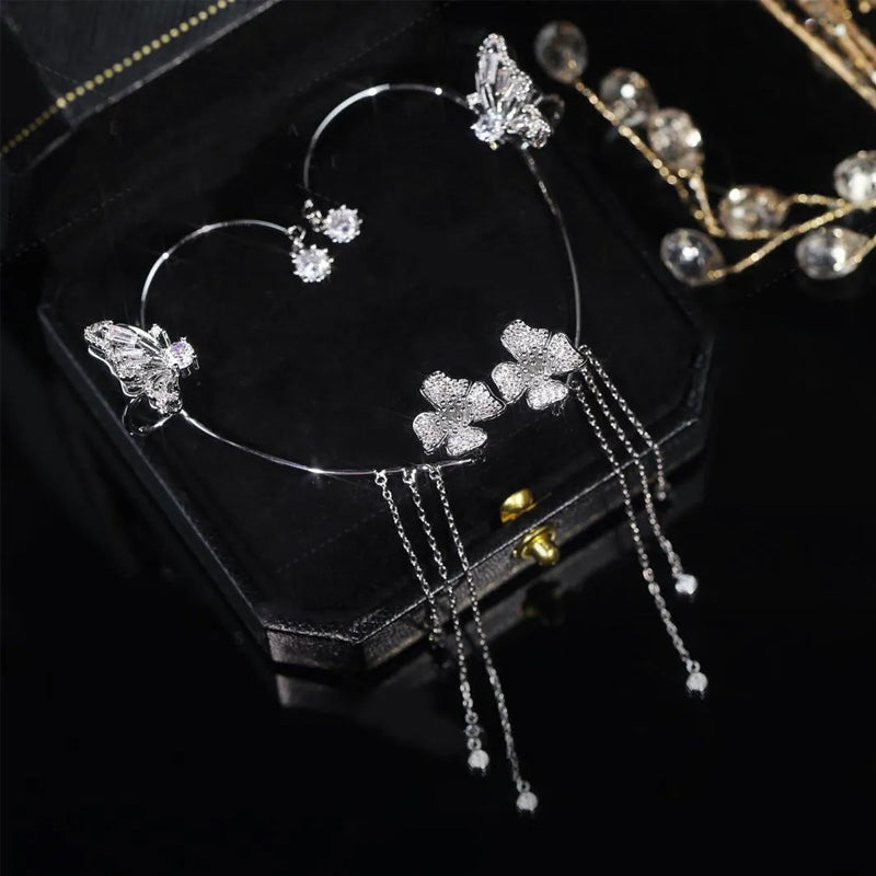 Butterfly-shaped earrings with zirconia and tassels