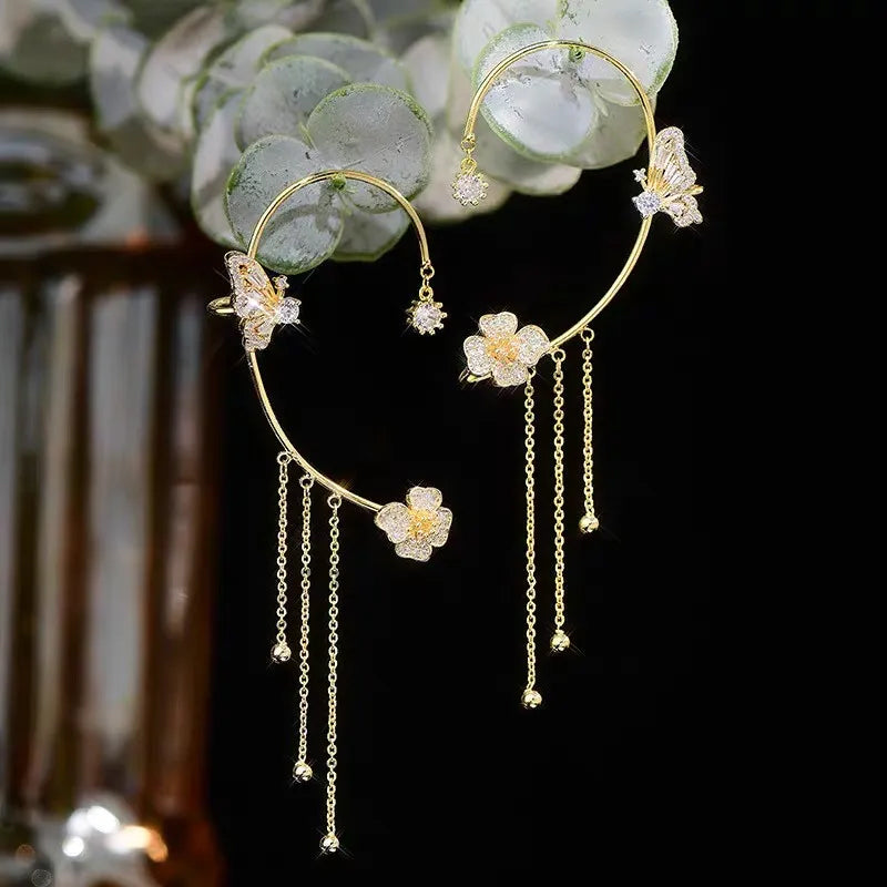 Butterfly-shaped earrings with zirconia and tassels