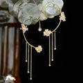 Butterfly-shaped earrings with zirconia and tassels
