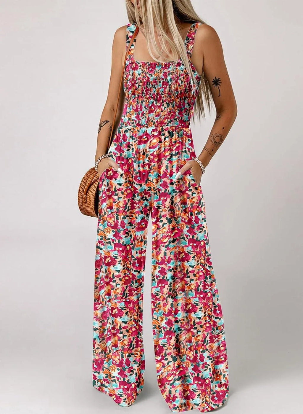 DE RDUCTION Combinaison sans manches pour femme, motif floral, poitrine smockée et jambes larges, chic et estivale.