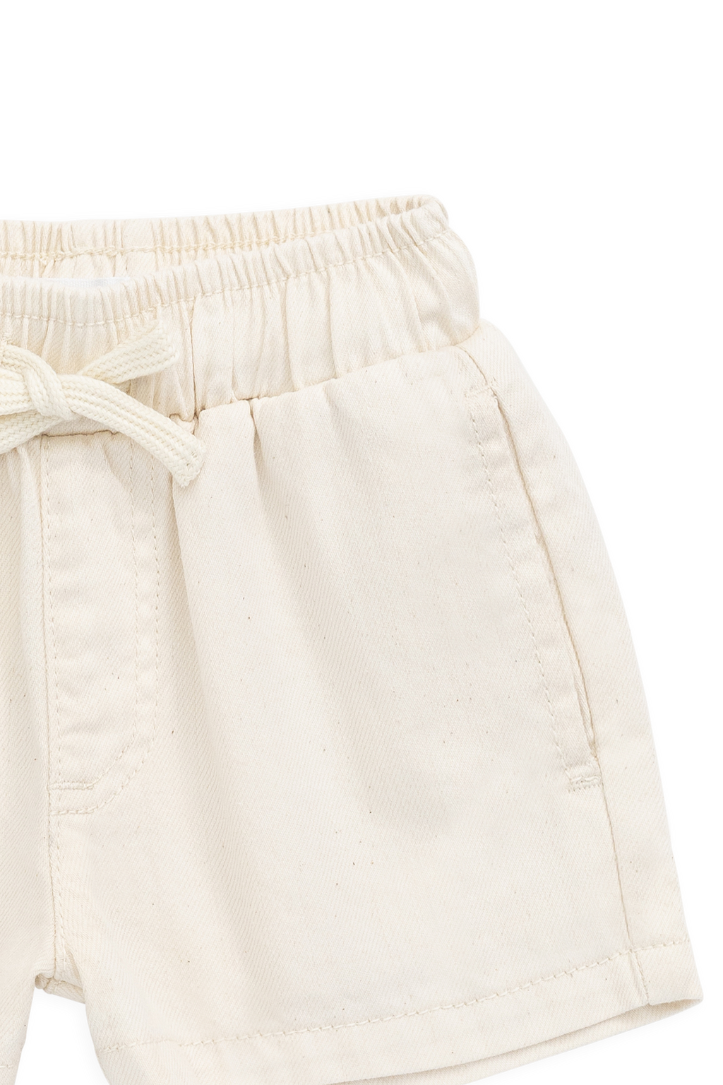 Short décontracté en coton texturé crème uni avec taille élastique et cordon de serrage décoratif pour les jeux d'été des enfants