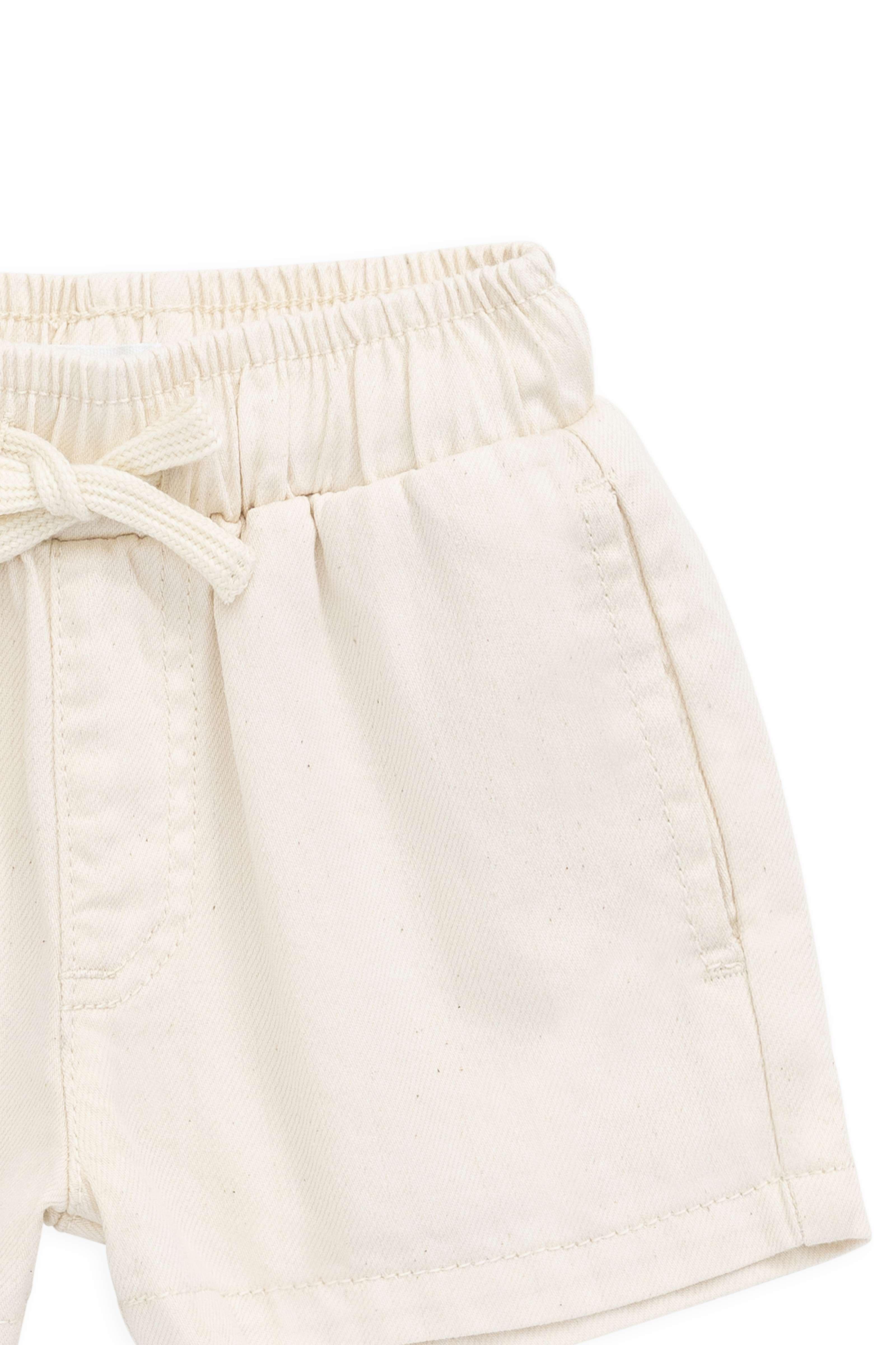 Short décontracté en coton texturé crème uni avec taille élastique et cordon de serrage décoratif pour les jeux d'été des enfants