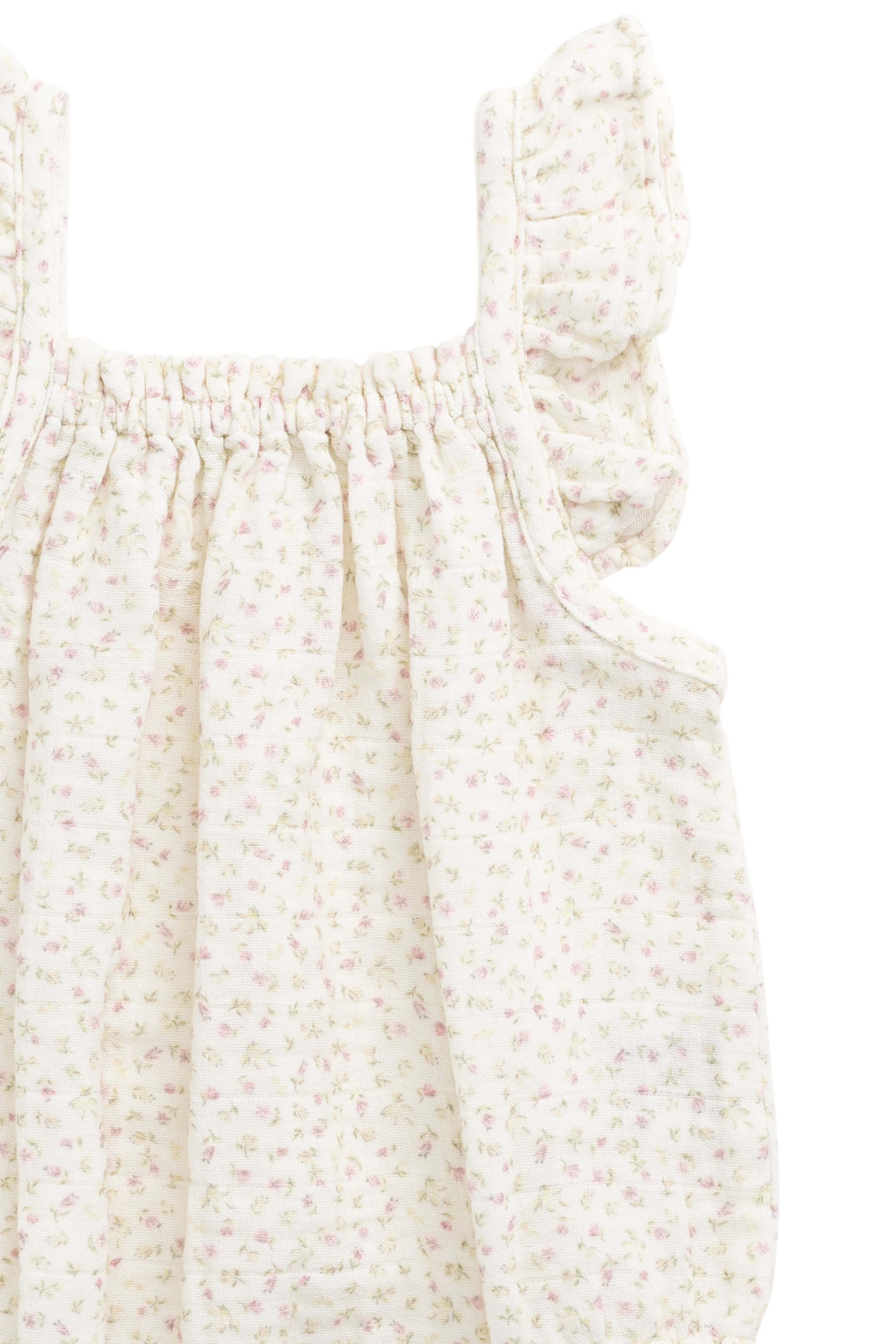 Barboteuse bébé en mousseline de coton biologique imprimé floral rose bohème, coupe décontractée, tissu respirant, idéale pour les jeux par temps chaud.