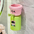 Adhesive toothbrush holder with magnetic suction cup