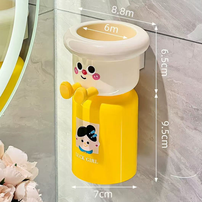 Adhesive toothbrush holder with magnetic suction cup