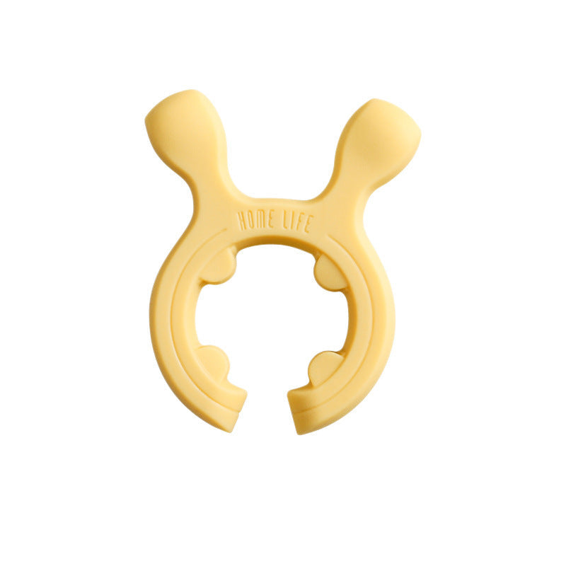 Support multi-fonctions en silicone pour poignées de casseroles et spatules